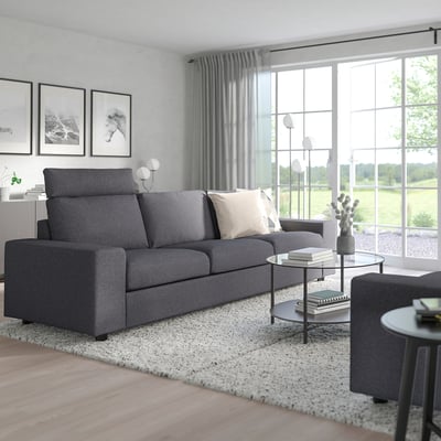 Cosy living room with VIMLE charcoal sofa, high headrests, light grey wall, large window, and neutral rug.