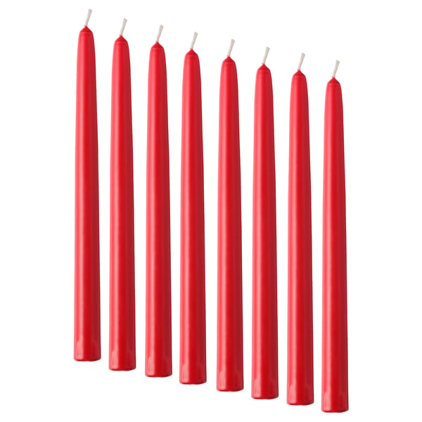 Eight red, cylindrical candles lined up, each with a white wick tip. Sleek and simple design.