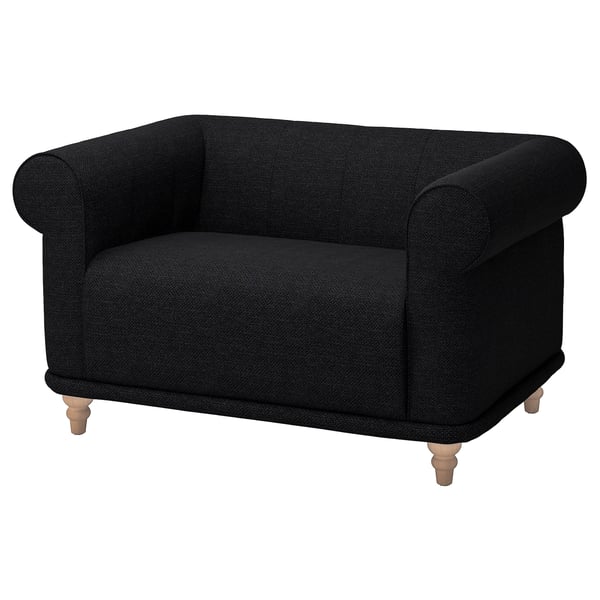 Comfortable black VISKAFORS armchair with soft, rounded shapes, wooden legs, and a cosy, embracing design.