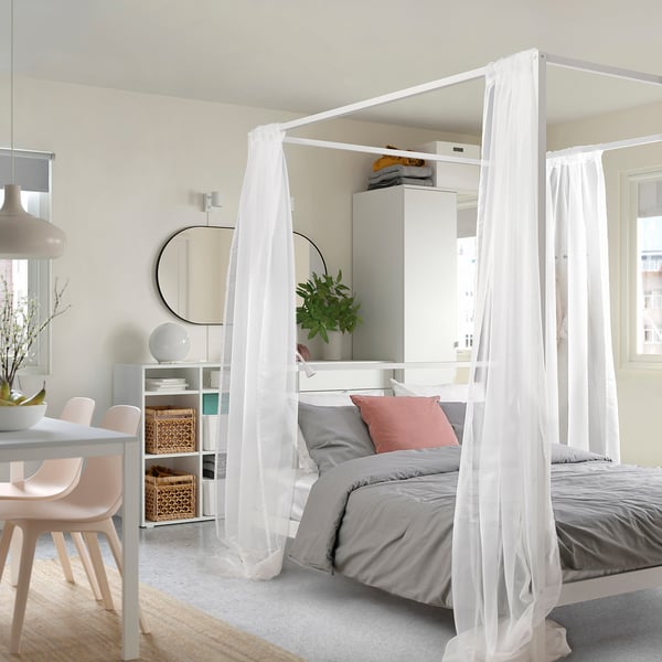 VITARNA four-poster bed in minimalist room, white curtains, large and sturdy.