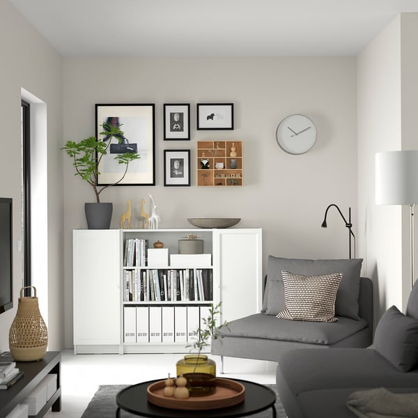Living room with BILLY bookcase, grey sofa, decor, coffee table. Alternatively: modern living room: BILLY bookcase, grey sofa, coffee table, decor.