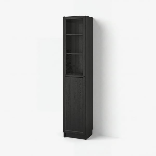 Tall black BILLY bookcase with glass door. Simple, modern design. Wooden texture finish.