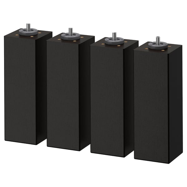 Four black, square wooden legs with adjustable feet. Modern, minimalist furniture design.