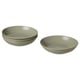 Four elegant, pale green FÄRGKLAR bowls, three stacked, one alone; simple, shallow design with smooth glaze, modern style.
