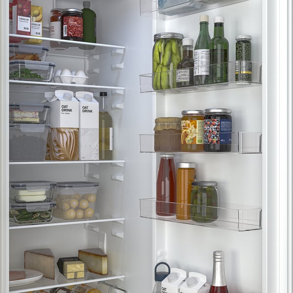 Fridge with glass shelves, led lights, and organised compartments.
