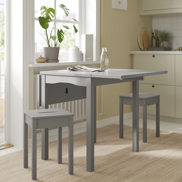 Grey HAUGA stool & table set for small spaces, solid pine with cut-out handle.