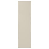 A beige HAVSTORP cabinet door with a smooth, modern design made of acrylic paint and fiberboard.