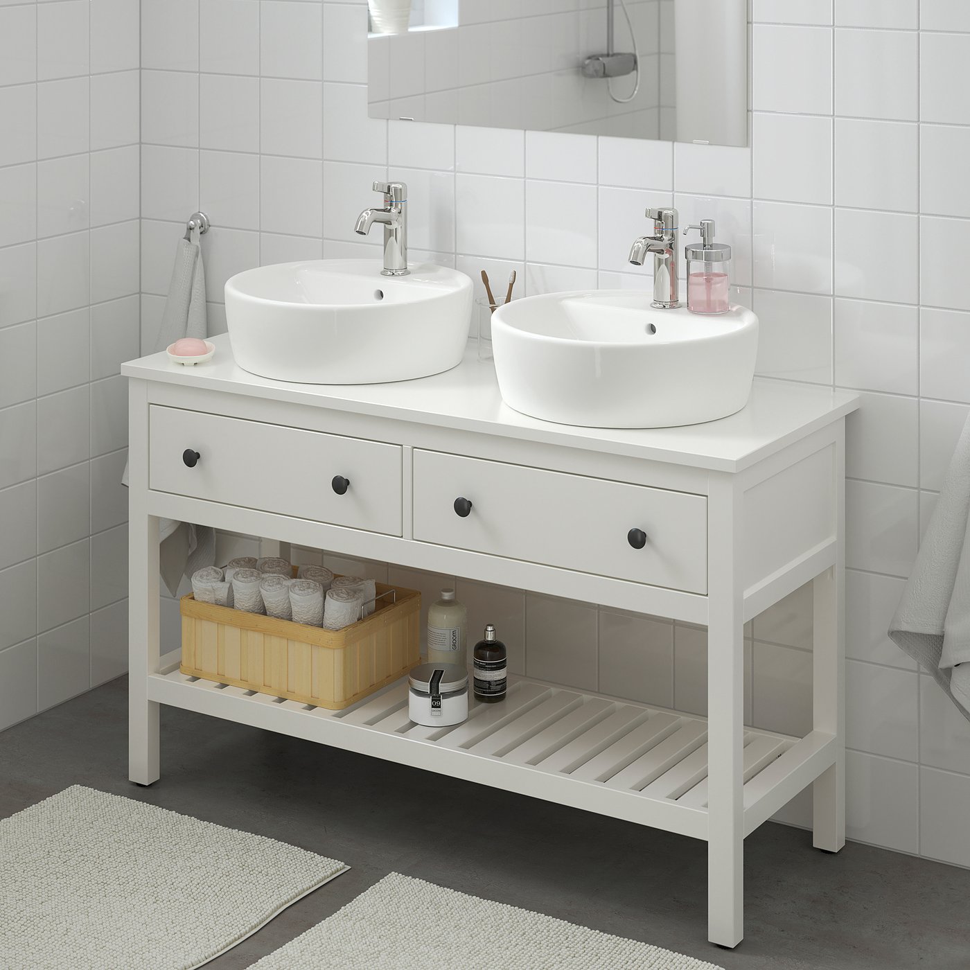 HEMNES vanity: 2 sinks, large mirror, 3 drawers, open shelf with toiletries and towels. Spacious, ideal for shared use.