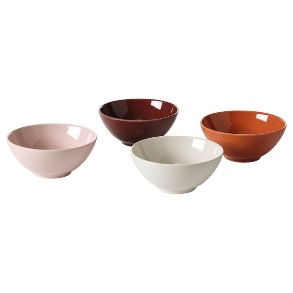 Four ceramic bowls in pink, brown, white, and orange, round and simple design.