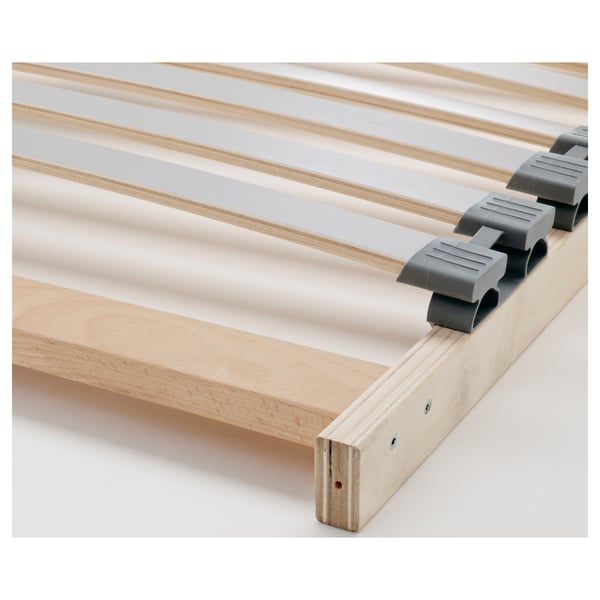 Close-up of sturdy bed frame with smooth, soft-closing drawer glides. Visible wooden slats and robust construction.