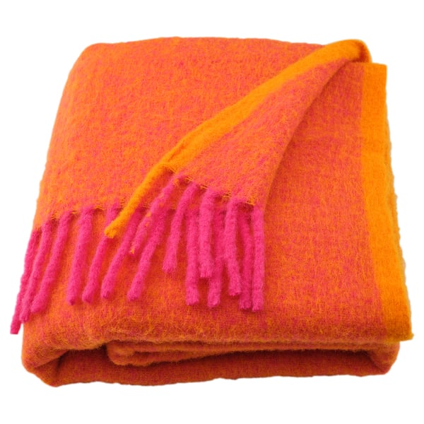 Bright orange/yellow folded blanket with pink fringe, soft, fluffy, recycled polyester.