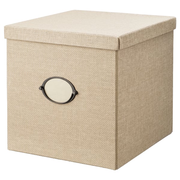 A KVARNVIK storage box in beige, crafted from woven paper and metal, featuring a classic design with a label holder.