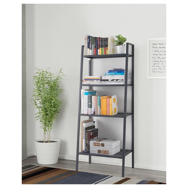 Bookshelf with multiple shelves holds books and decor. Its designed with both style and practicality in mind for organising and displaying items.