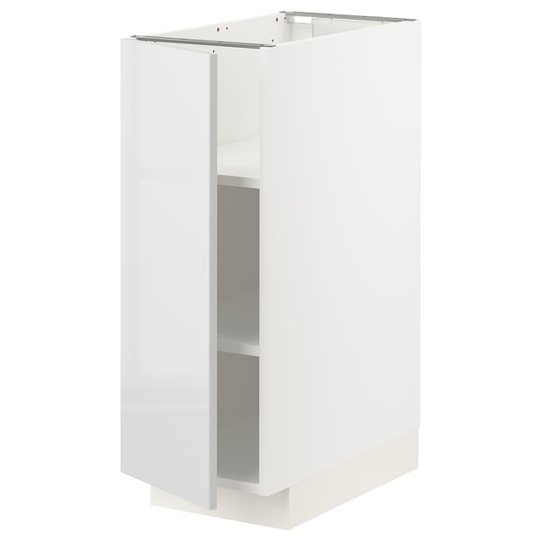 White kitchen cabinet, modern design, glossy finish, rectangular shape. Part of the METOD system, sturdy build with adjustable shelves.