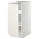 A white METOD kitchen cabinet with smooth design, featuring adjustable shelves and snap-on hinges, ideal for modern kitchens.