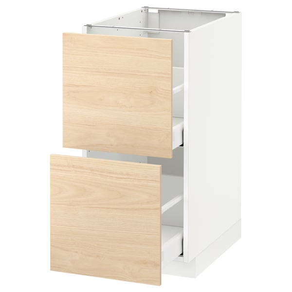 Modern kitchen cabinet with light ash drawers, minimalist design, and metal runners.
