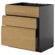 Modern black kitchen unit with three wooden drawers.