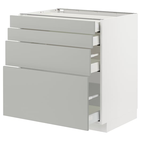 White METOD kitchen unit with light grey drawers.