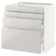 Modern white kitchen cabinet from METOD system with three glossy drawers and steel runners.