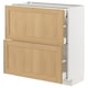 METOD kitchen cabinet with light oak veneer drawers and white base, featuring bevelled edges and sleek design.