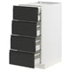 Modern white METOD kitchen unit with four matte black drawers, sleek handles, and clean lines.