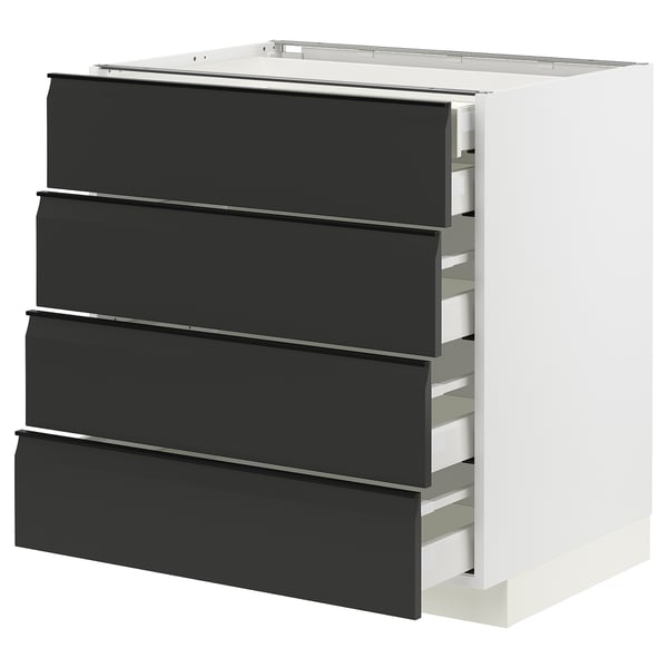 Modern kitchen unit with four black drawers, sleek handles, and white frame, perfect for contemporary decor.