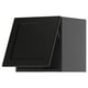 Black kitchen cabinet, modern and angular, made of wood, with sleek lines and a traditional character.