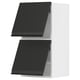 Modern black kitchen cabinets with sleek handles, part of the METOD system, featuring a two-tone design and gentle door closing mechanism.