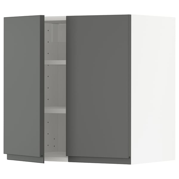 A grey METOD kitchen cabinet with one door open, revealing adjustable shelves.