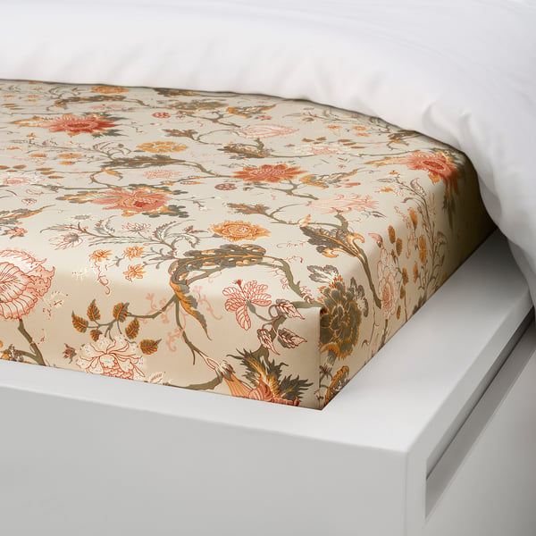 Floral-patterned bed sheet on white mattress, showcasing soft, moisture-wicking fabric for comfort.