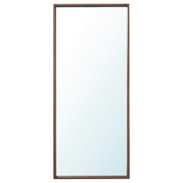 A vertical NISSEDAL mirror with a slim brown frame. It can hang both ways, is safe for bathrooms, and has a modern simple design.