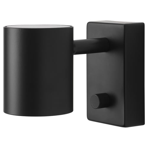 Black NYMÅNE wall lamp with adjustable round shade, matte finish.