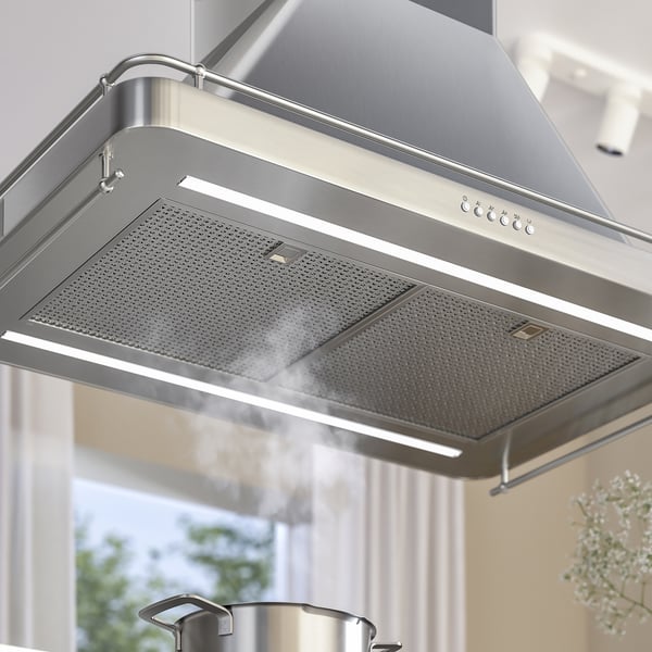 Modern stainless steel range hood with sleek design and integrated led lighting.