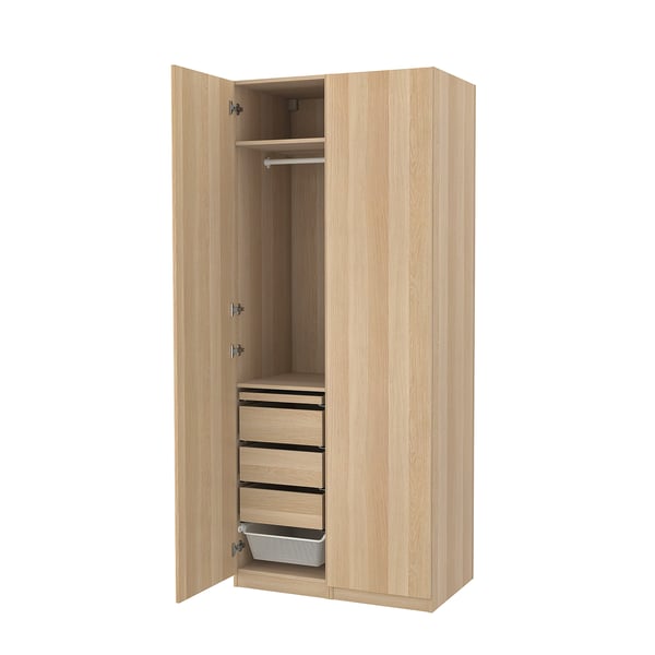 Open wooden PAX wardrobe with drawers and clothing rod.