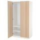 An IKEA PAX wardrobe with light wood doors, white interior, adjustable shelves, and soft-close hinges.