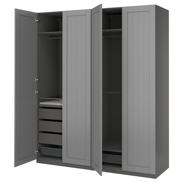 A grey IKEA PAX wardrobe with open doors, revealing shelves and drawers.