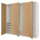 An IKEA PAX wardrobe with light oak doors and white interiors. It has adjustable shelving and hanging space.