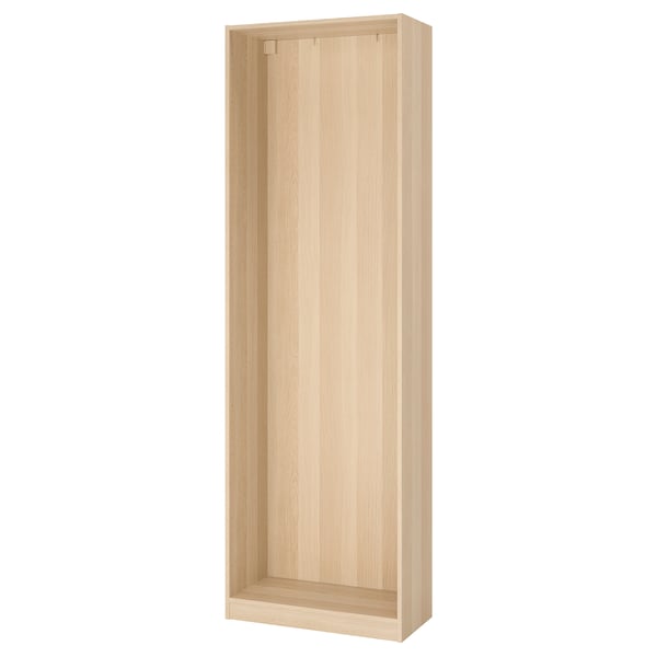 An ikea PAX wardrobe frame in white-stained oak. Its a tall, rectangular, foldable closet with a minimalist design, perfect for small spaces.