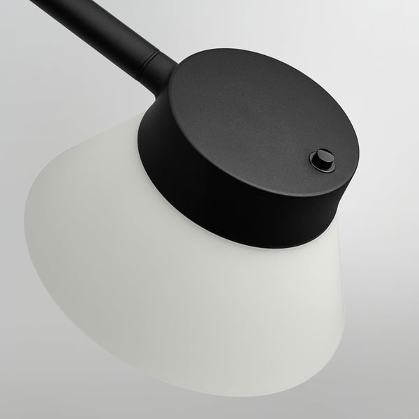 Adjustable black floor lamp with a frosted white shade, featuring a flexible neck for precise lighting direction.
