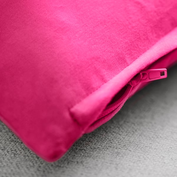 Bright pink cushion cover with zip, smooth cotton velvet texture.