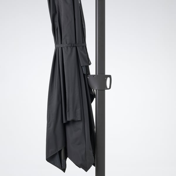 Image shows dark SEGLARÖ parasol with tilt and 360-degree rotation, upf 50+ uv protection, secured by strap.