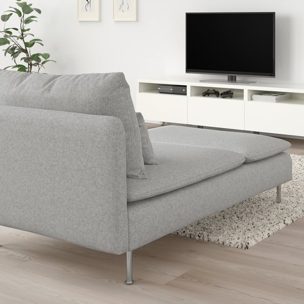 Modern living room with grey chaise longue and tv.