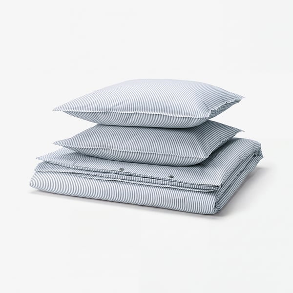 A neatly folded SOLFIBBLA duvet set in blue and white stripes, made from recycled cotton.