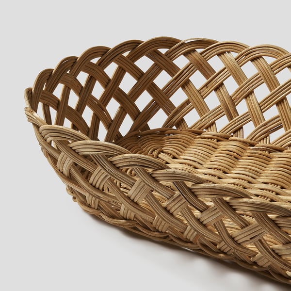 Handwoven rattan basket, finely crafted, with intricate lattice pattern, natural tan finish, sturdy and stylish for home decor.