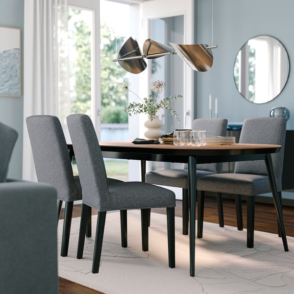 TJÄRKIL dining set: walnut table, 4 grey chairs, compact, stylish lighting.