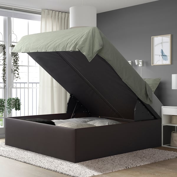 Modern bed with lift-up storage, soft-close lid, and plush mattress.