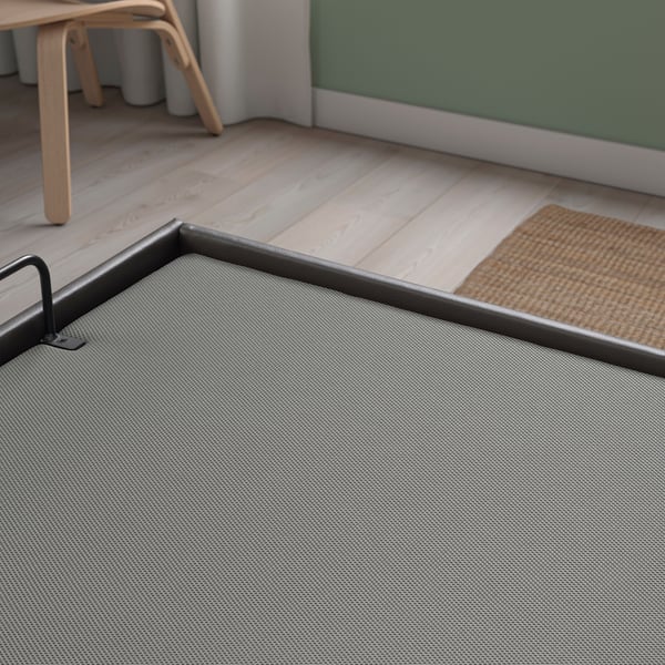 Modern TJÅLLE bed with durable recycled fabric, soft-closing lid, and hidden storage space.