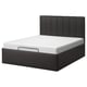 Modern black bed with padded headboard and built-in storage, sleek design.