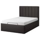 Modern black platform bed with padded headboard, sleek design.