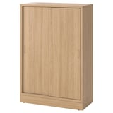 Light brown TONSTAD cabinet, rectangular with sliding doors, minimalist design, two adjustable shelves inside.